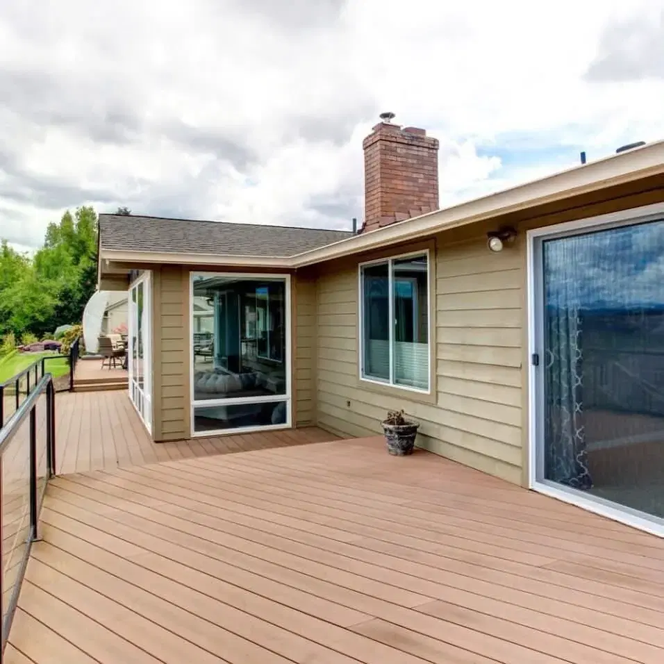 Wraparound composite deck with cable railing and slider access